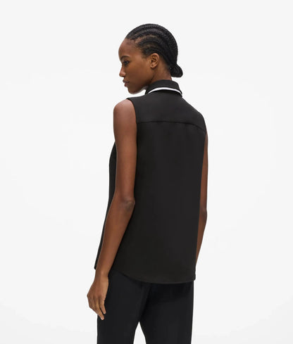 Black and white sleeveless blouse