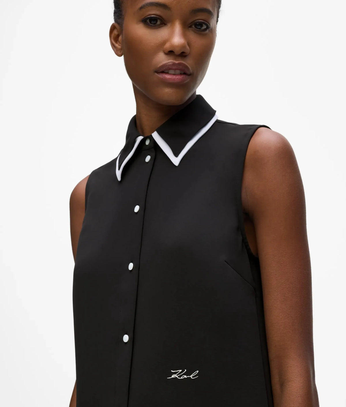 Black and white sleeveless blouse