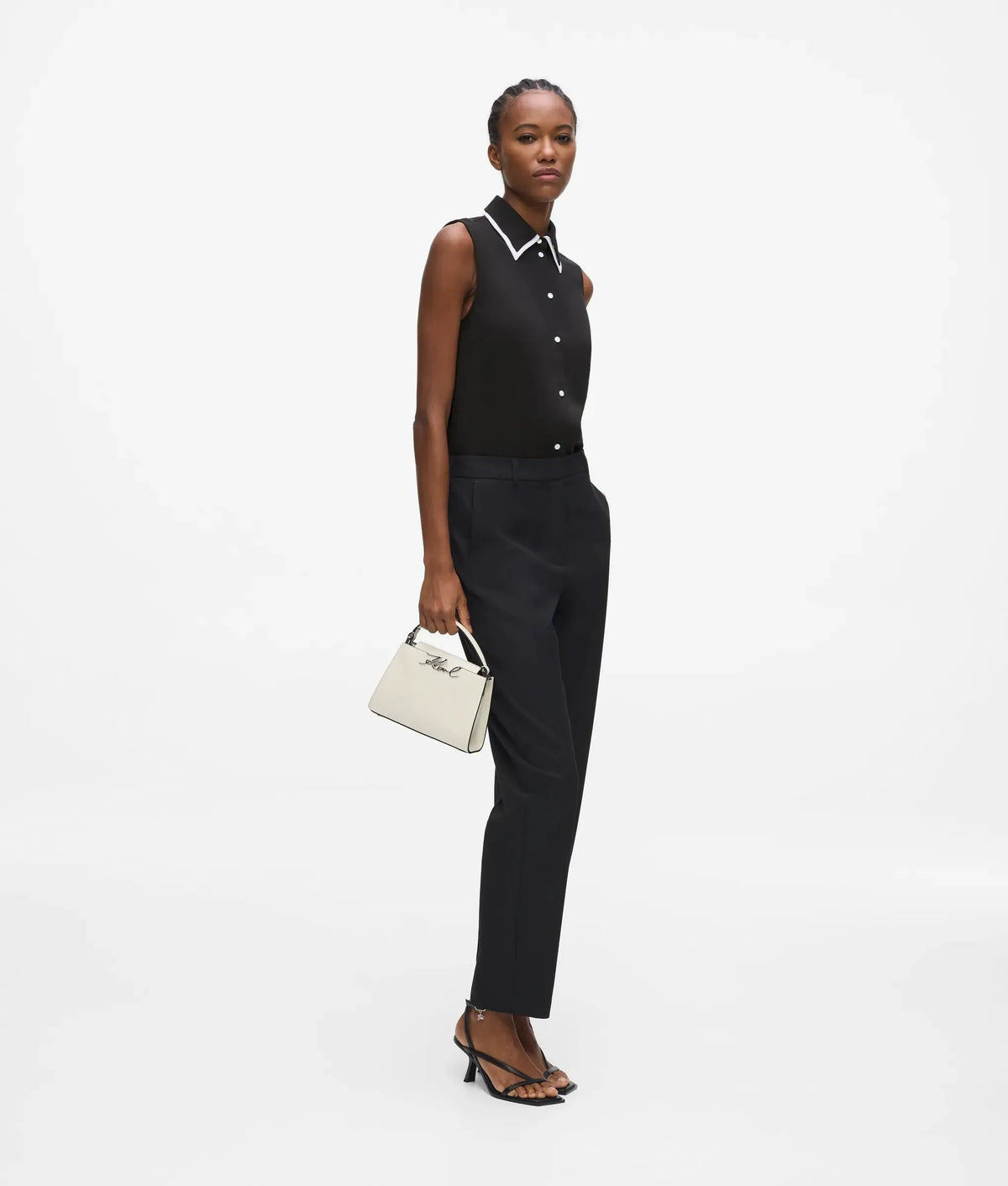 Black and white sleeveless blouse