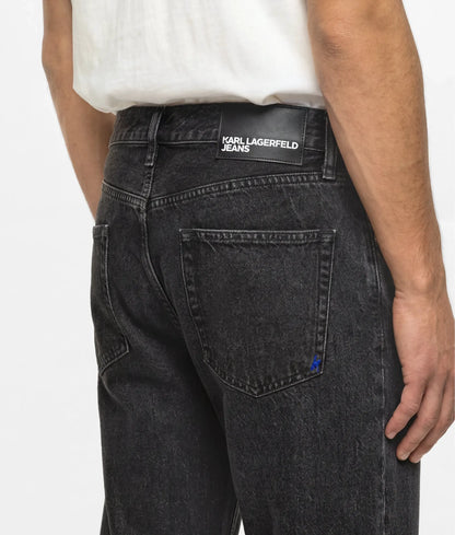 Washed black tapered jeans